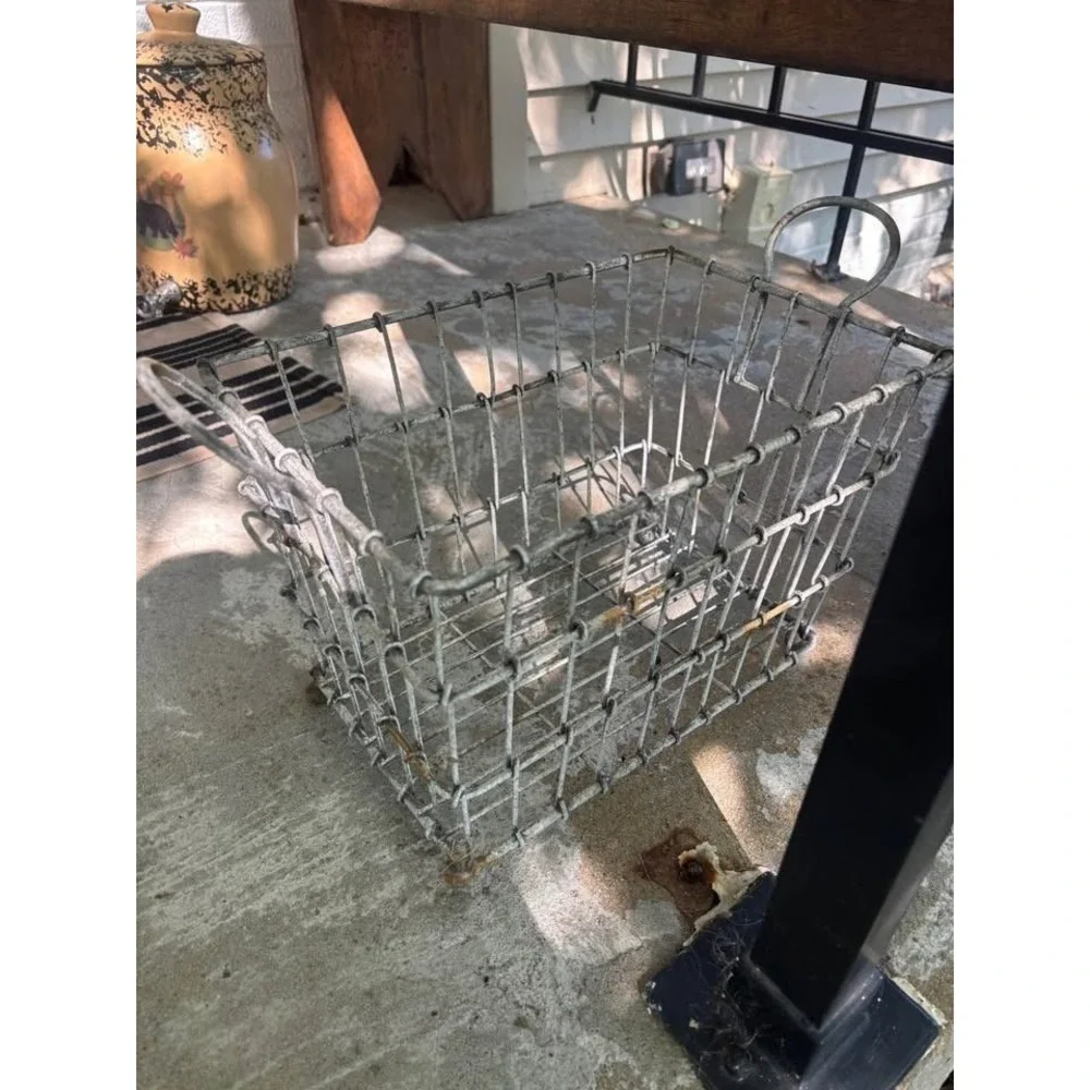 Farmhouse primitive wire basket . Great to hold cookbooks . Very heavy w handles